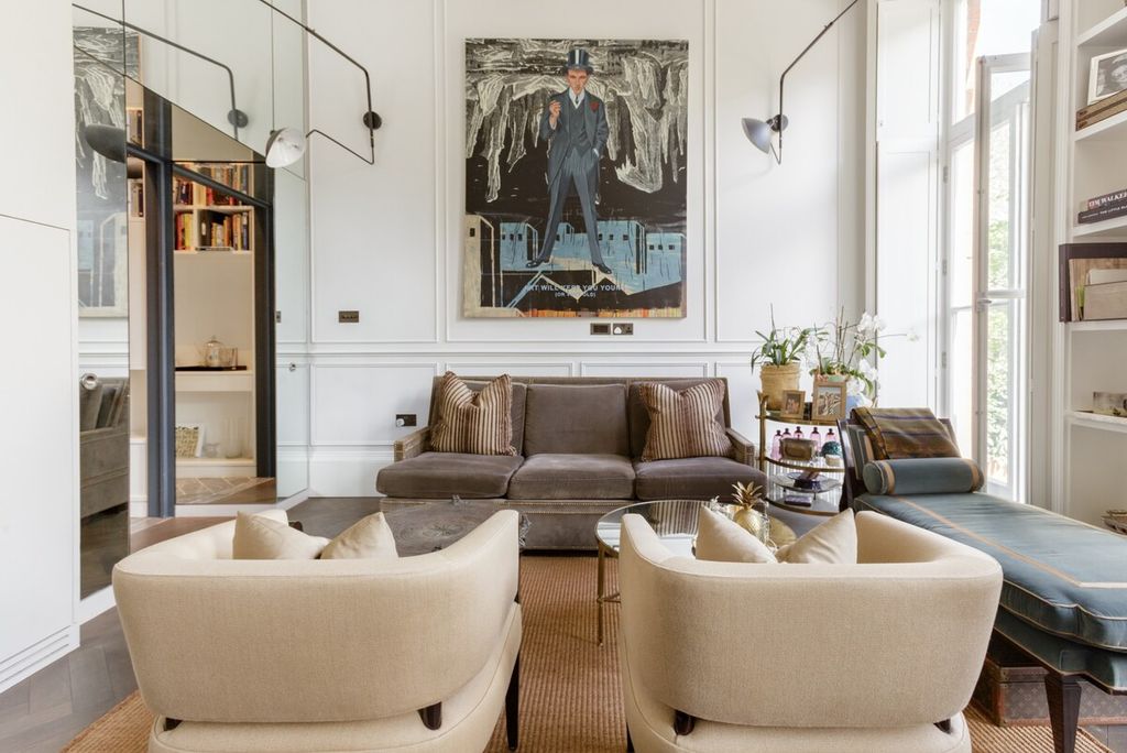 Image may contain Furniture Table Living Room Room Indoors Human Person Coffee Table and Chair