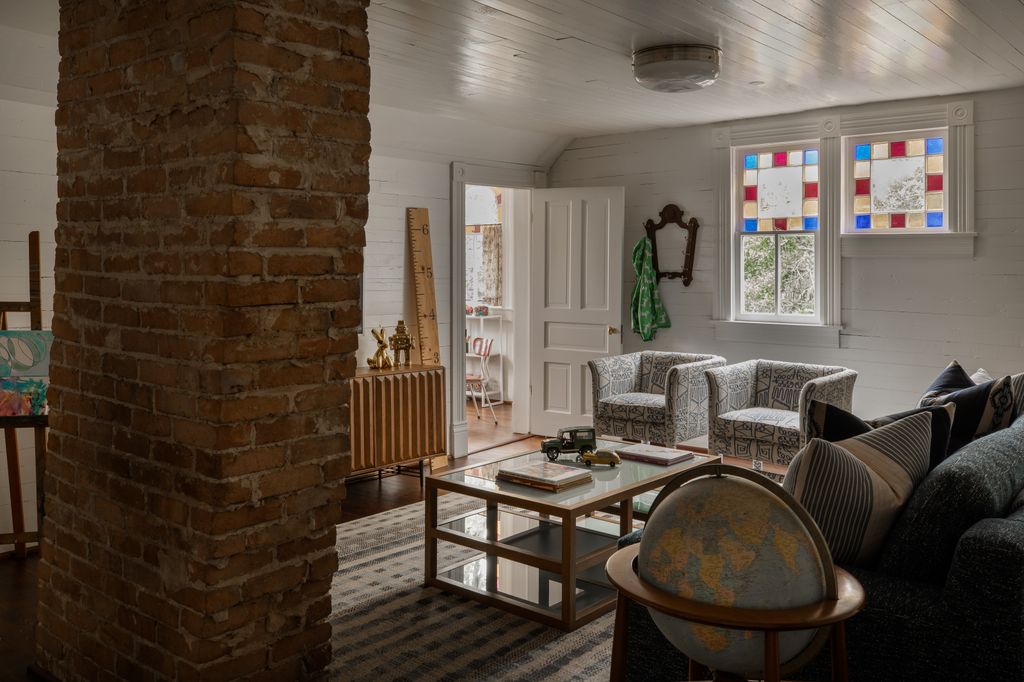 Image may contain Living Room Room Indoors Furniture Couch Flooring Interior Design Wood and Floor