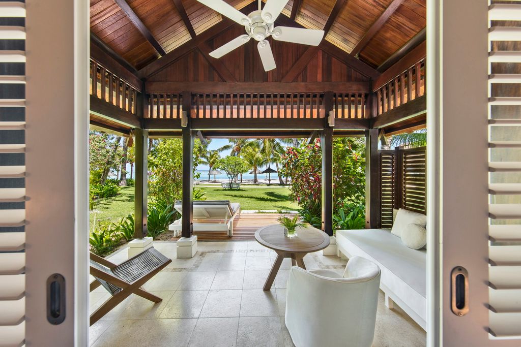 Image may contain Interior Design Indoors Appliance Ceiling Fan Porch Furniture Table Patio and Flooring