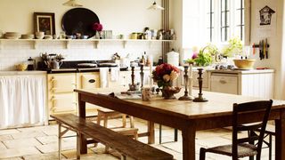 Image may contain Room Indoors Furniture Dining Room Dining Table Table Wood Kitchen Island Hardwood and Chair