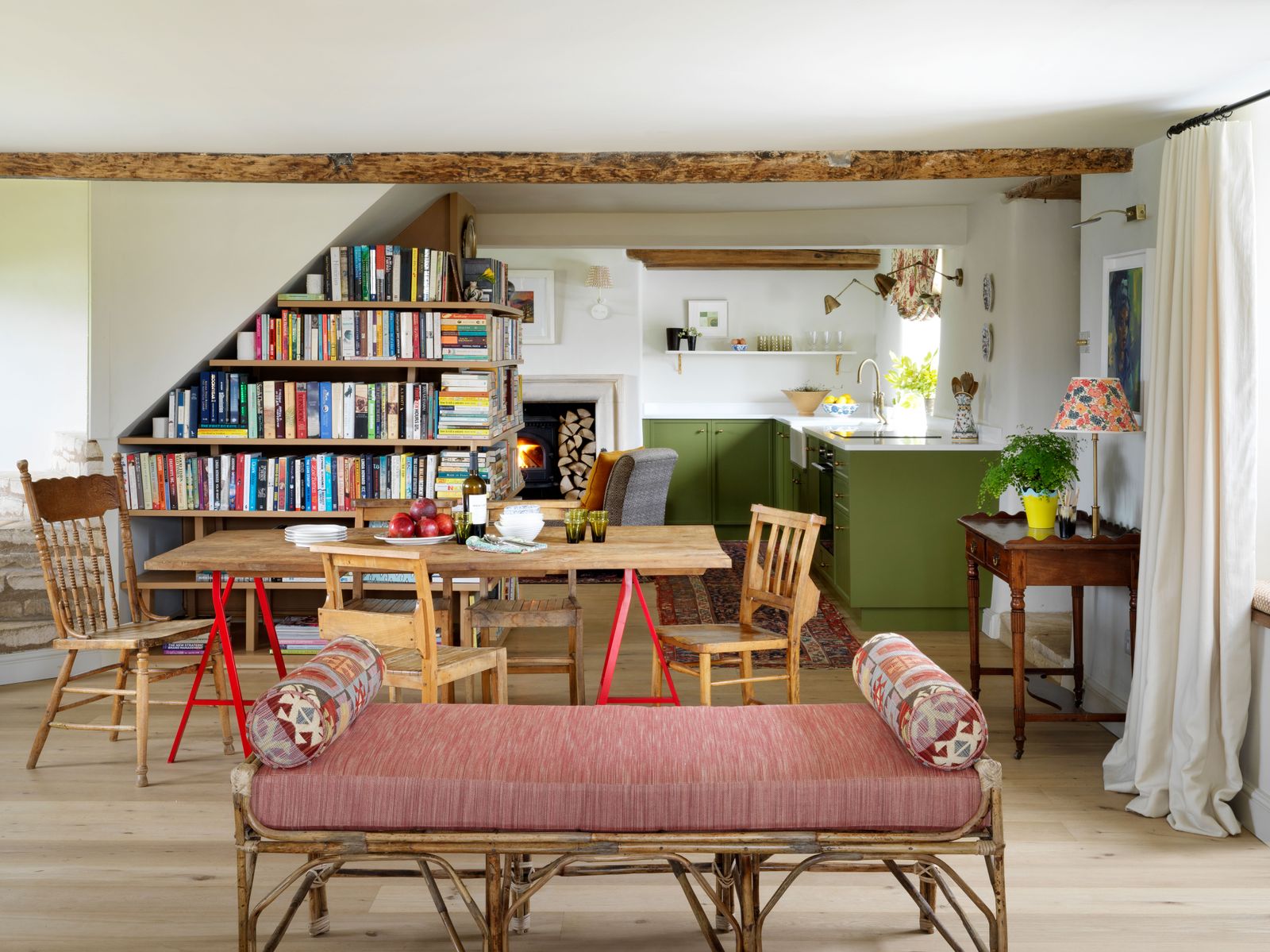 Image may contain Furniture Shelf Chair Bookcase Living Room Room Indoors Interior Design Wood and Flooring