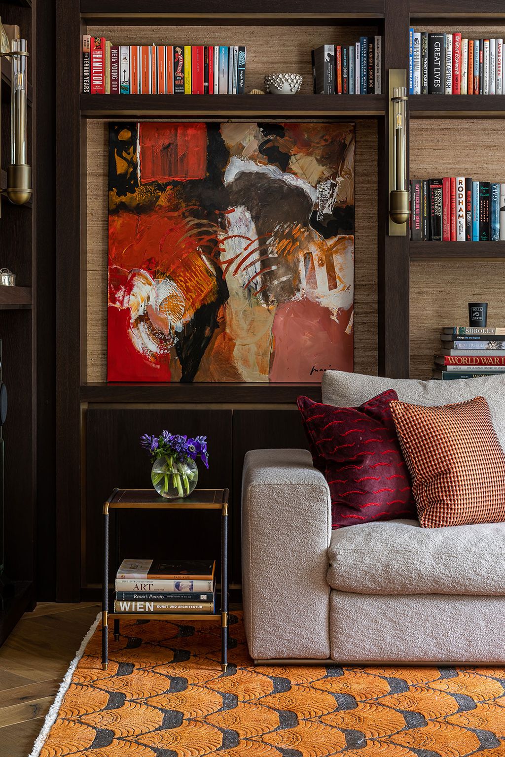 Image may contain Furniture Shelf Living Room Room Indoors Bookcase Couch Home Decor Cushion and Interior Design