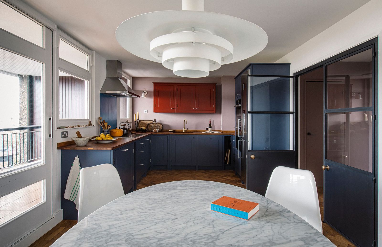 Image may contain Indoors Room Flooring Interior Design Kitchen Furniture Wood and Hardwood