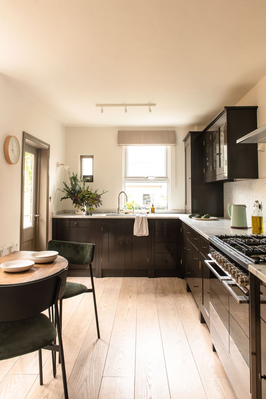 Image may contain Indoors Room Furniture Chair Interior Design Kitchen Island and Kitchen