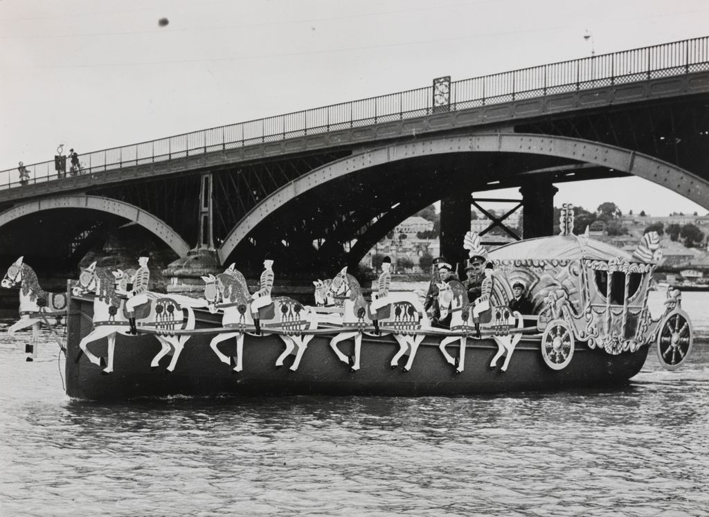 Image may contain Human Person Boat Vehicle Transportation Bridge Building Water Waterfront Vessel and Watercraft