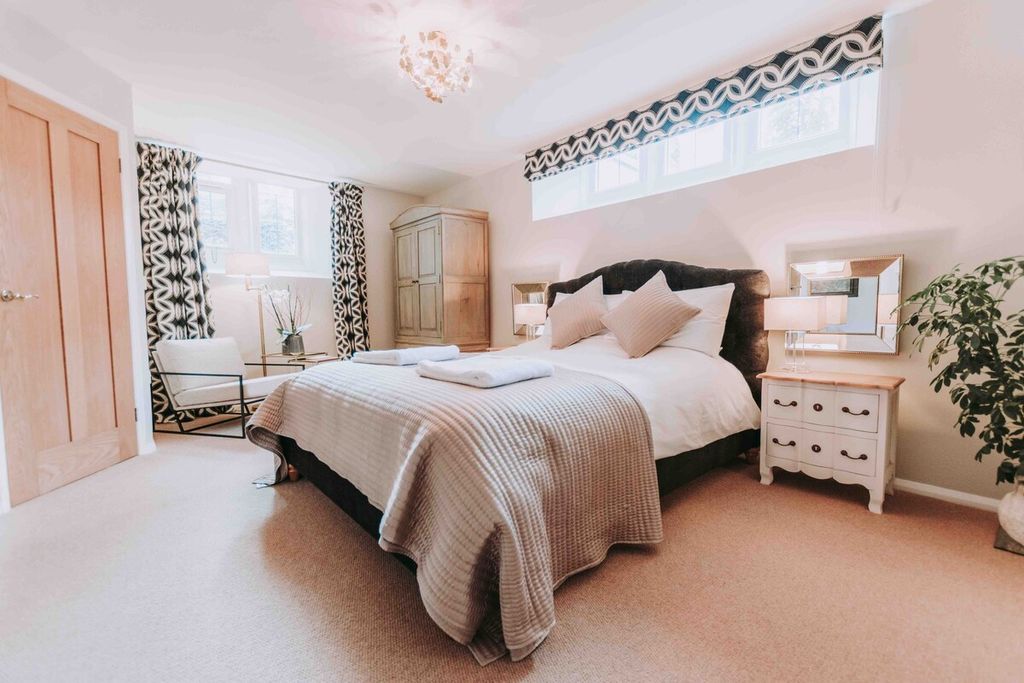 Image may contain Room Bedroom Indoors Furniture Bed Chair Dorm Room and Interior Design