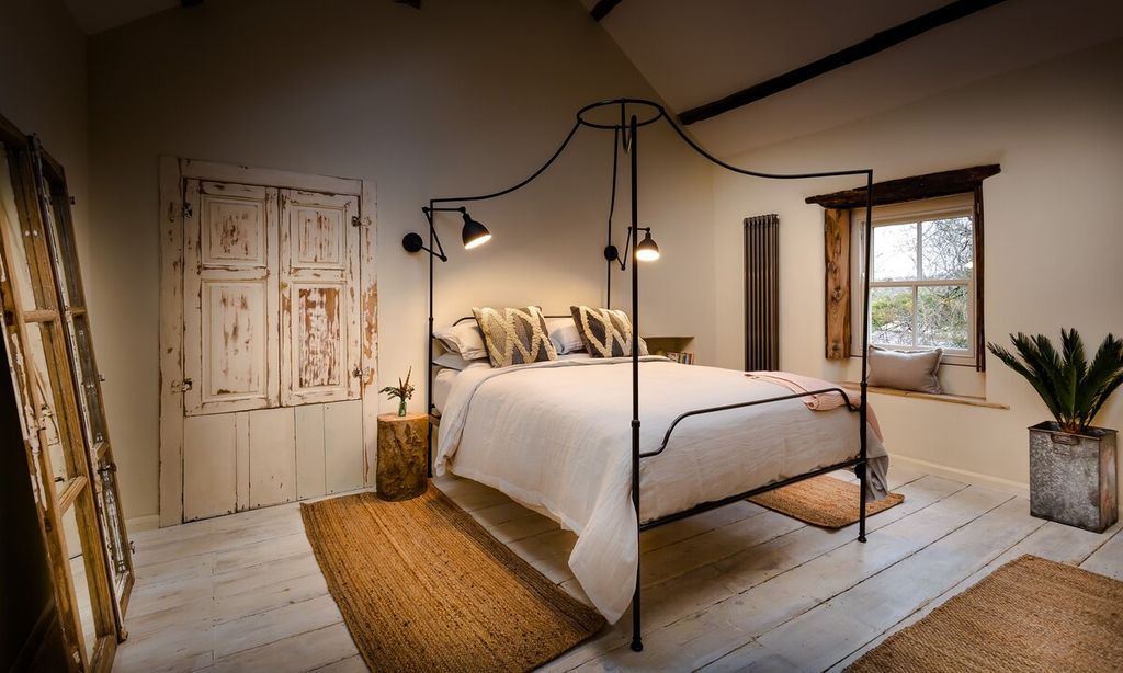 Image may contain Flooring Floor Wood Hardwood Furniture Bed Interior Design Indoors Room and Bedroom