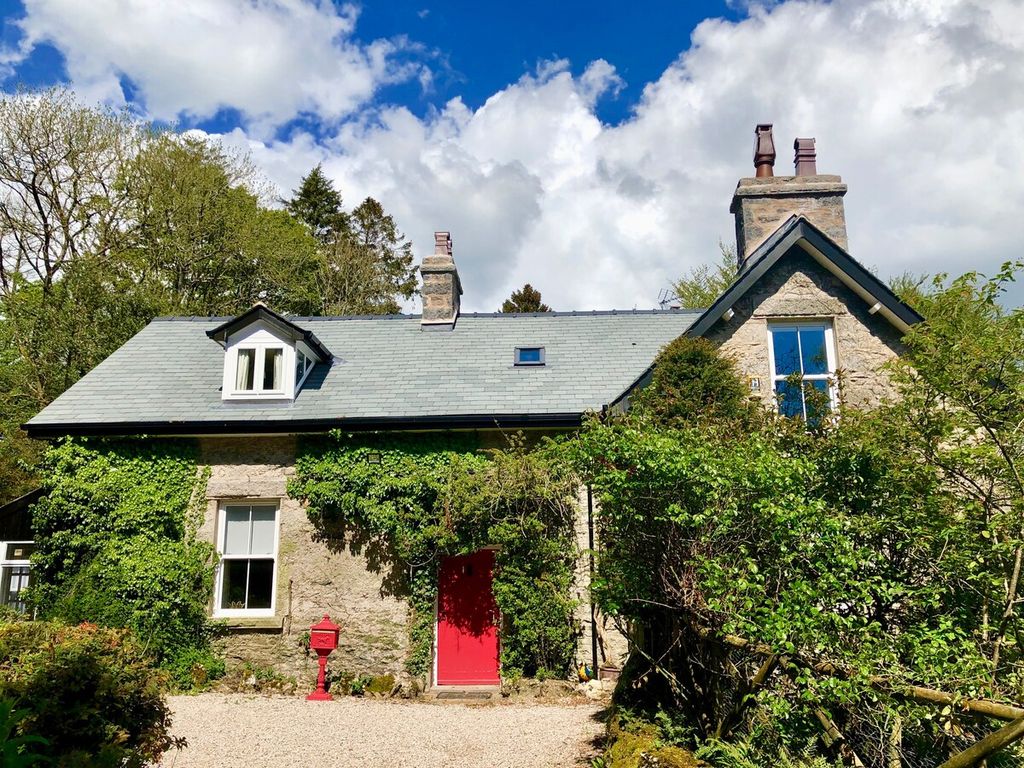 Image may contain Cottage Housing House Building Outdoors Nature Shelter Countryside Rural Plant and Garden