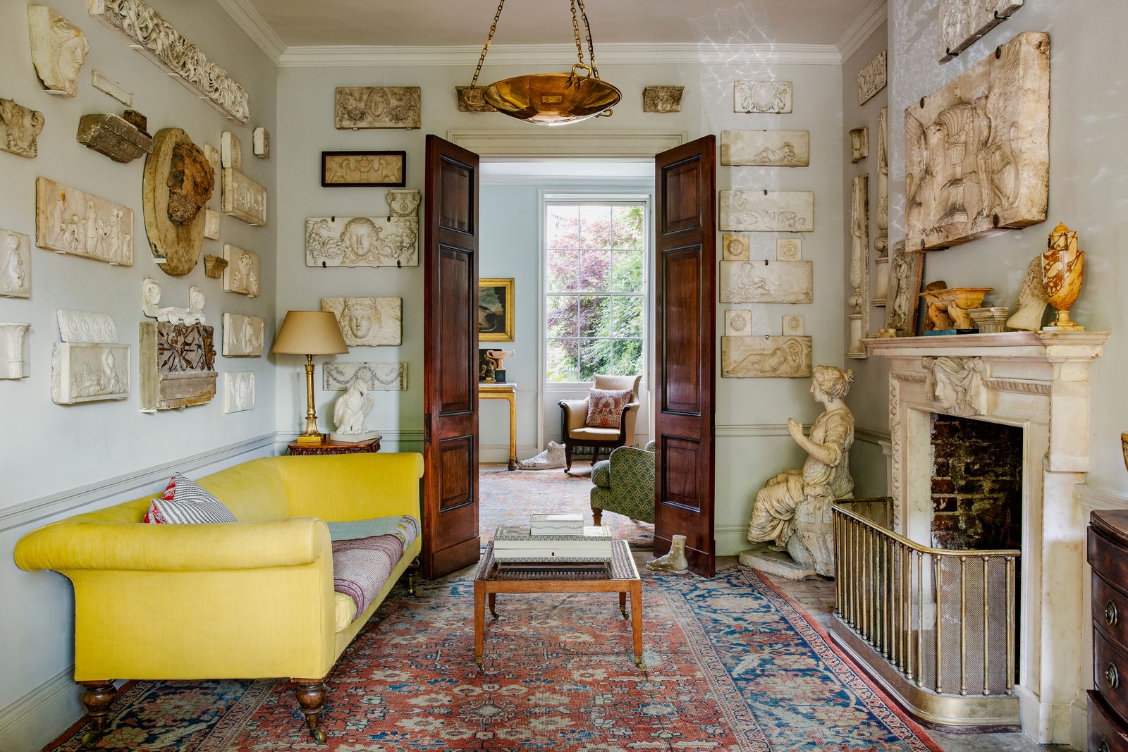 Image may contain Living Room Indoors Room Interior Design Flooring Furniture Couch Floor Home Decor Rug and Wood