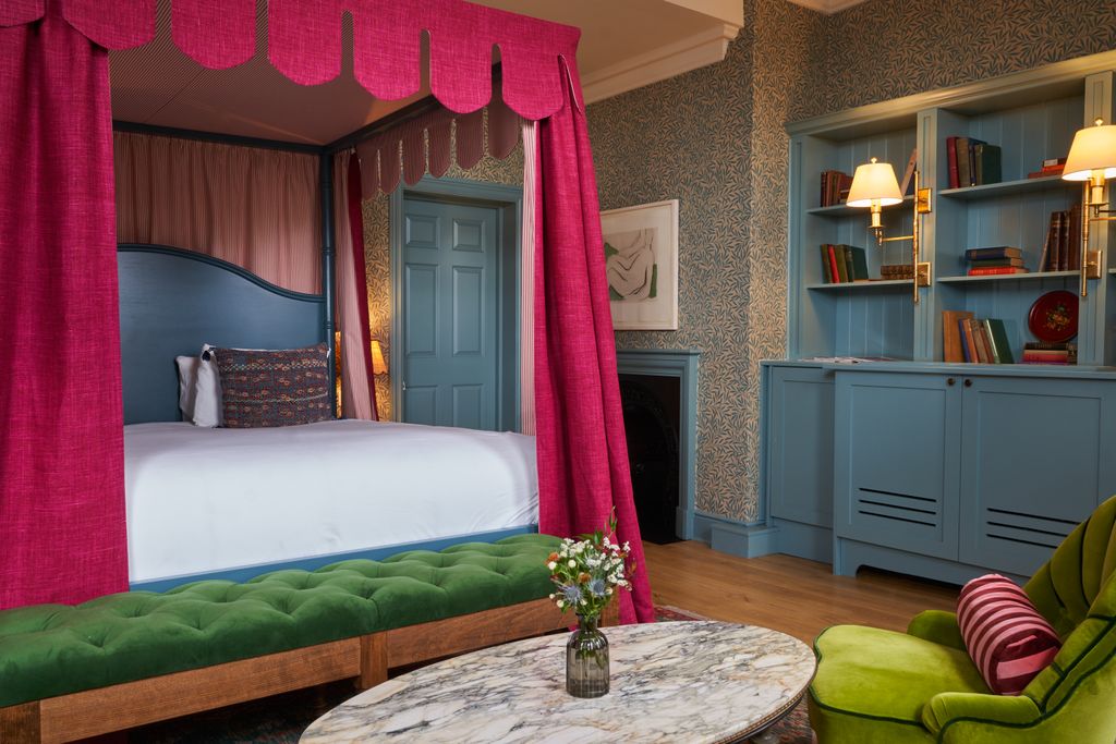 Image may contain Furniture Room Indoors Bedroom Living Room Interior Design Bed Cushion Table and Home Decor