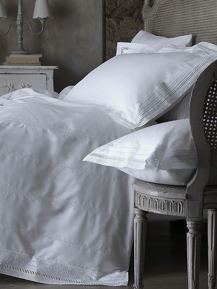 Image may contain: Furniture, Chair, Indoors, Room, Bedroom, Blanket, and Crib