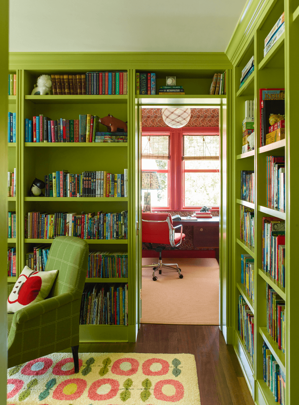 Image may contain Furniture Bookcase Shelf Rug and Indoors