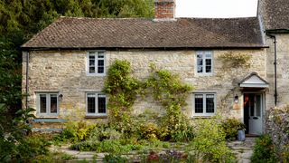 Image may contain Cottage Housing House Building Roof Grass and Plant