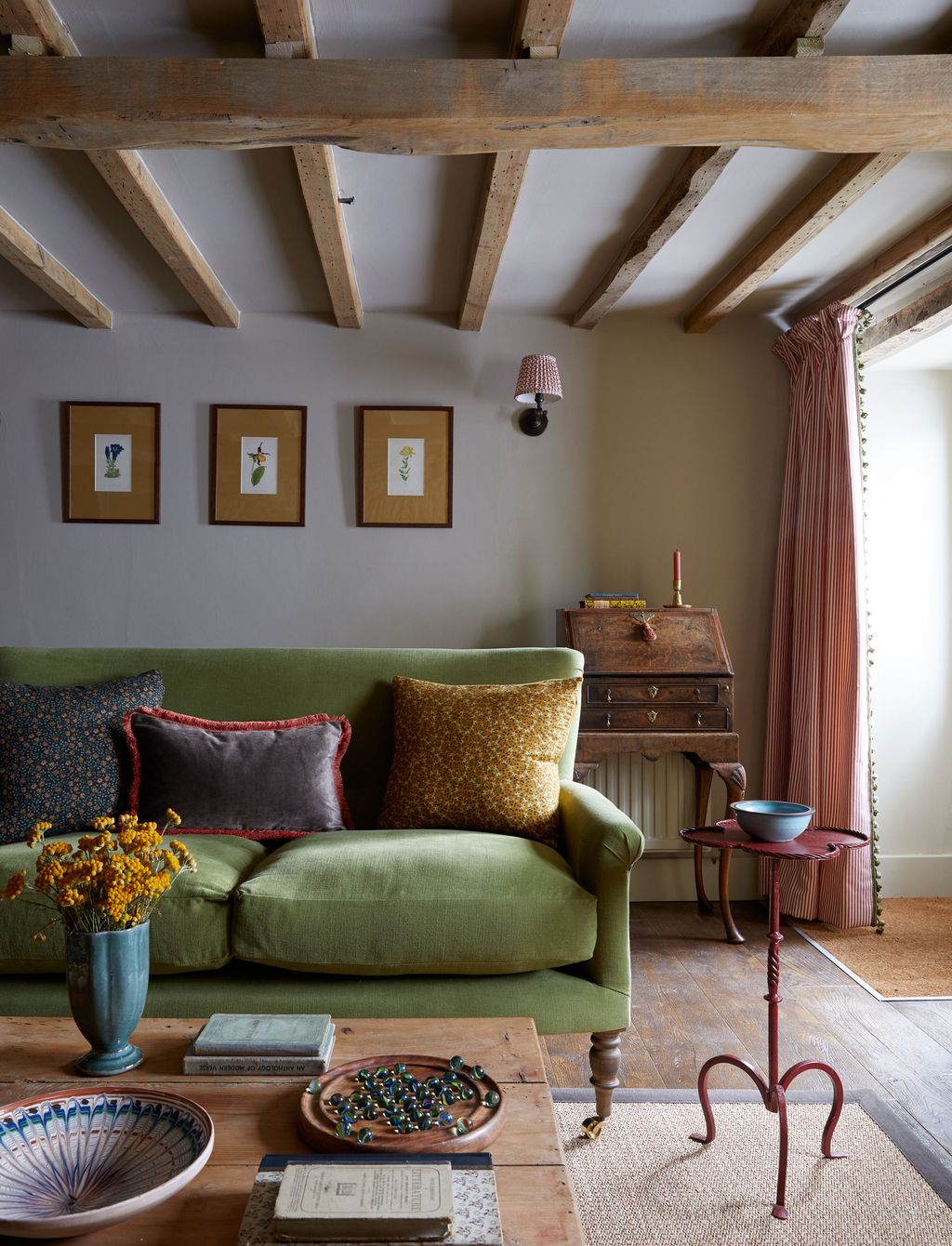 The cottage is filled with a mix of antiques and contemporary pieces.