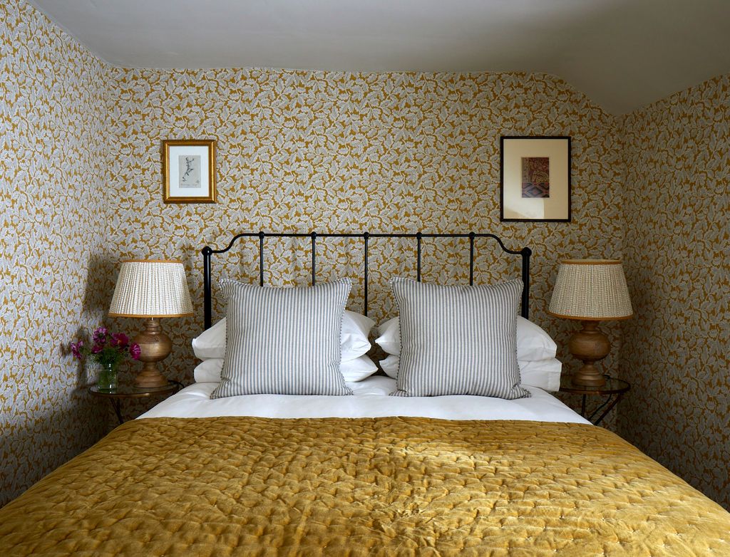 Image may contain Furniture Bed Lamp Table Lamp Indoors Room and Bedroom