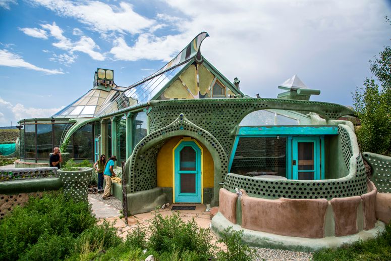 Image may contain: Human, Person, Shelter, Countryside, Rural, Outdoors, Nature, Building, Bush, Vegetation, and Plant