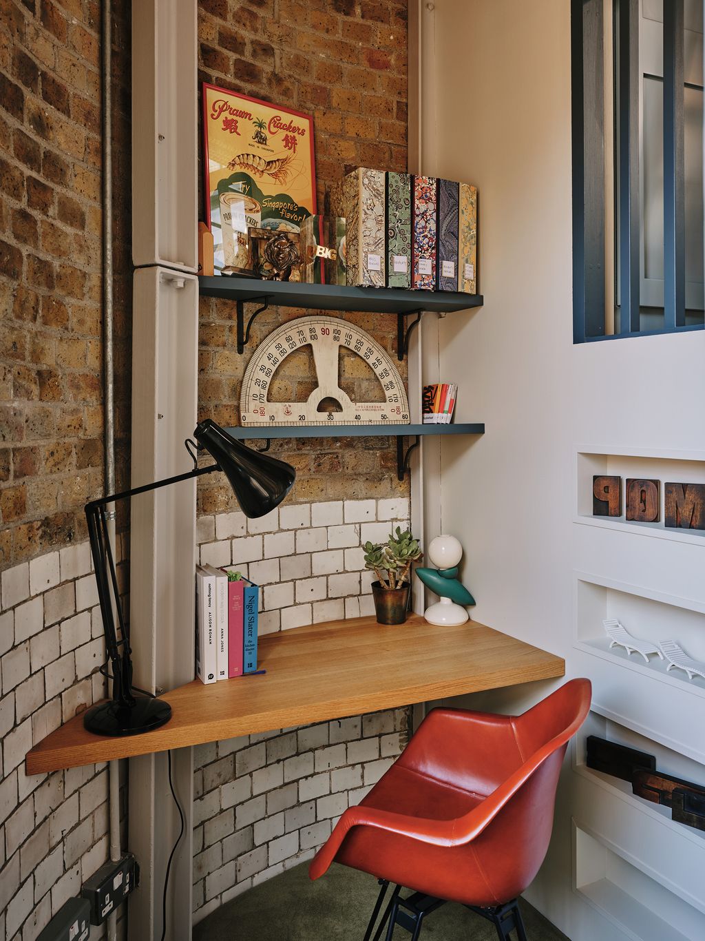 Image may contain Shelf Interior Design Indoors Furniture Chair Wood Living Room Room Bookcase and Plywood