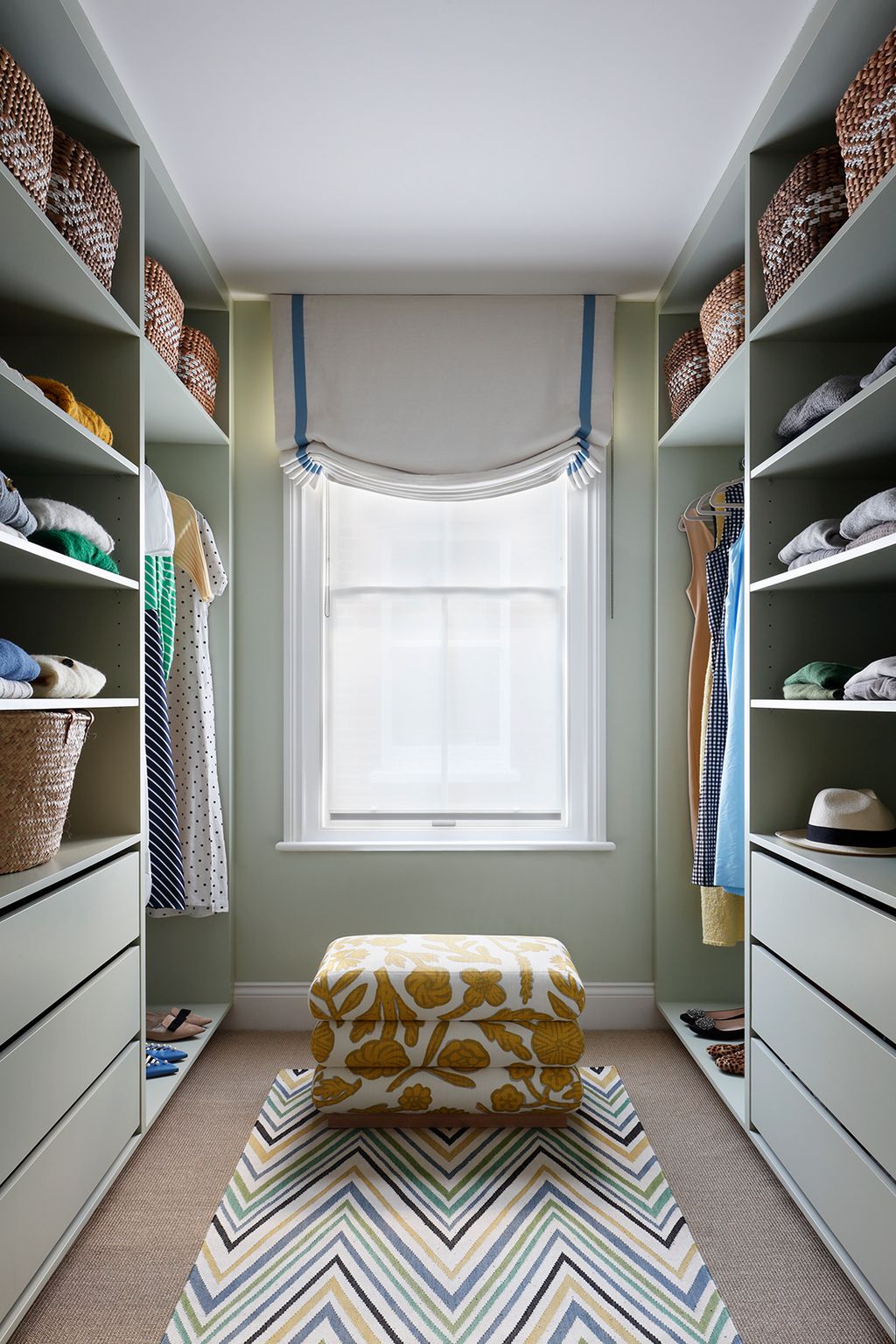 Image may contain Furniture WalkIn Closet Indoors Closet Rug Wardrobe and Room