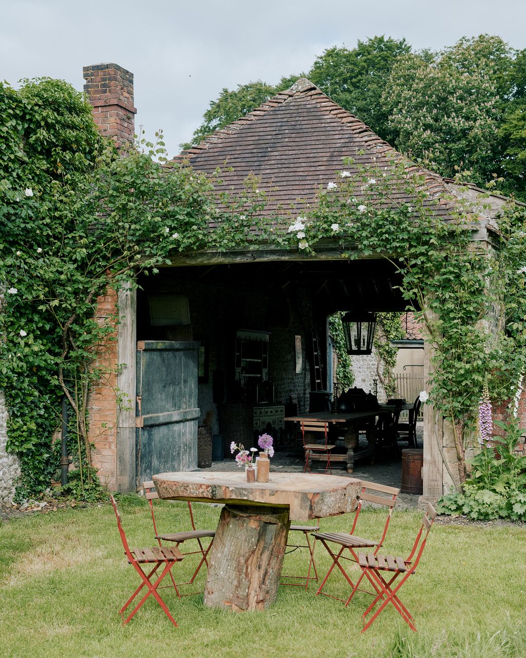Image may contain Outdoors Furniture Chair Patio Garden Arbour and Nature
