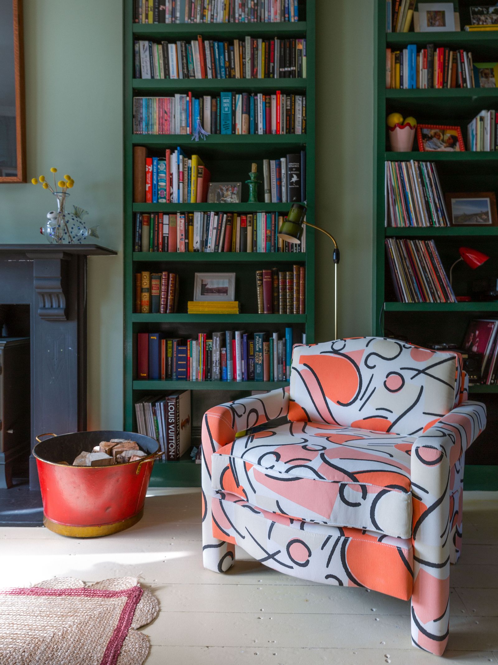 Image may contain Furniture Bookcase Shelf Living Room Indoors and Room