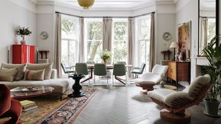 Image may contain Living Room Room Indoors Furniture Human Person Interior Design Lobby and Rug