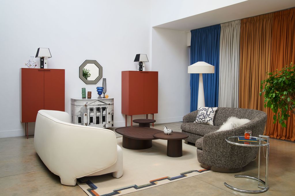 Image may contain Living Room Room Indoors Furniture Couch Table Interior Design Coffee Table and Rug