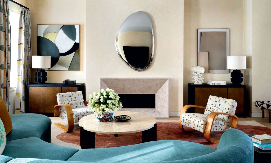 Image may contain Living Room Room Indoors Furniture Interior Design Couch Rug Table and Coffee Table