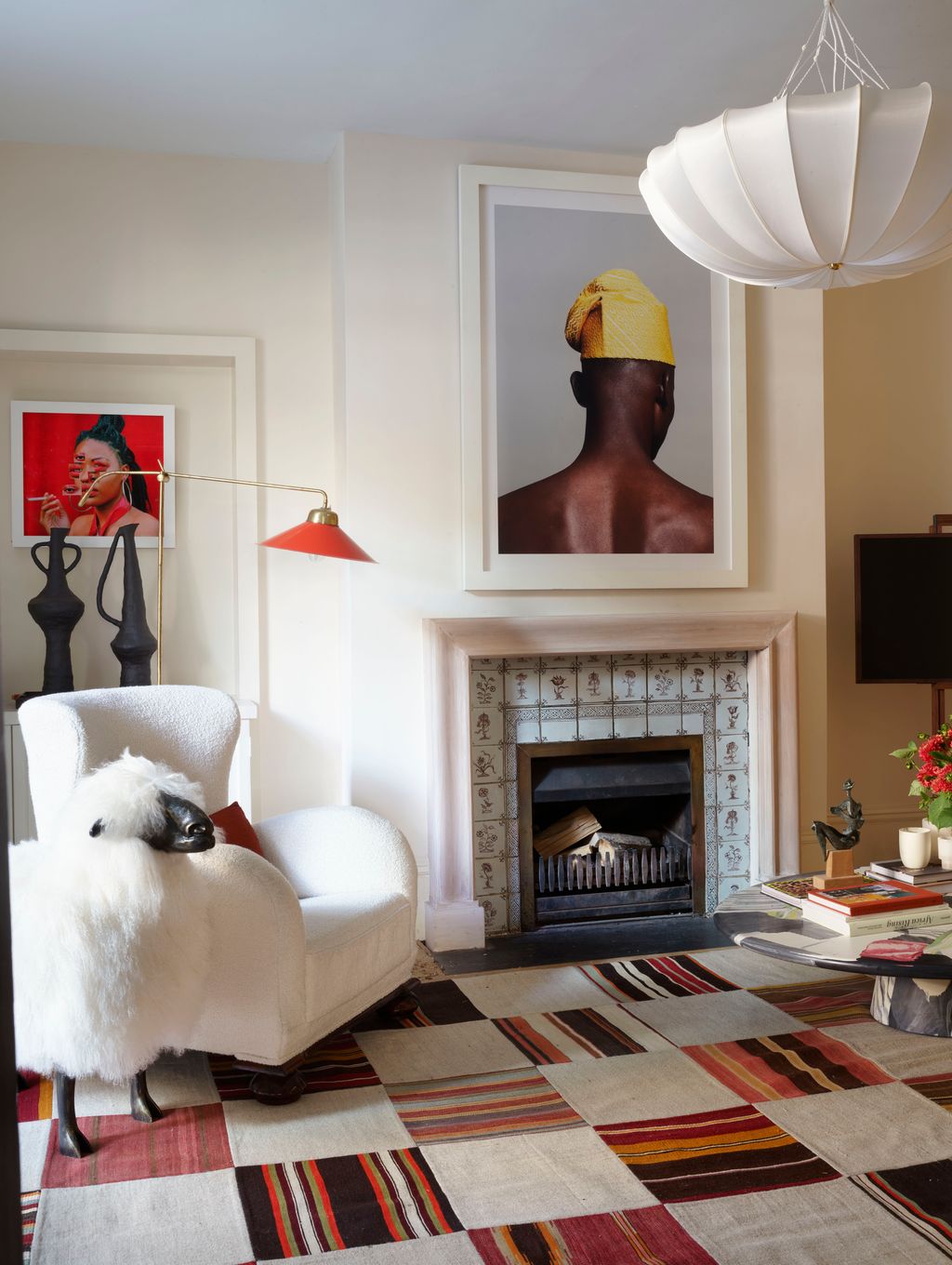 Image may contain Living Room Room Indoors Rug Fireplace Hearth Furniture and Interior Design