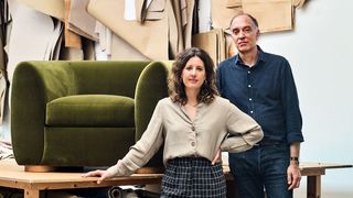 Image may contain Furniture Human Person Clothing Apparel Couch Shoe Footwear Table Living Room Indoors and Room