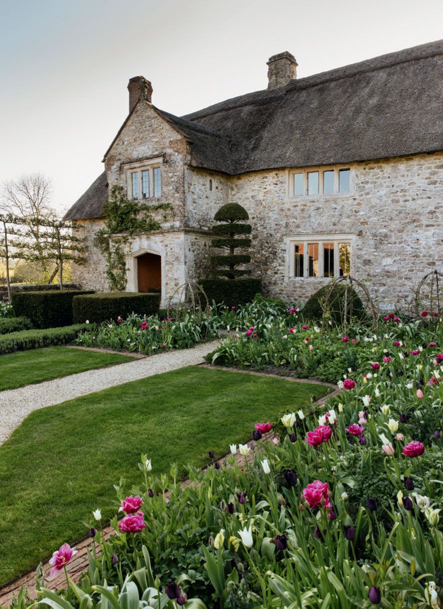 Image may contain Grass Plant Cottage Housing House Building Outdoors Garden Lawn Flower and Blossom