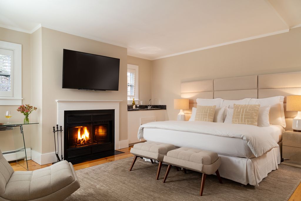 a white bedroom with a king size bed