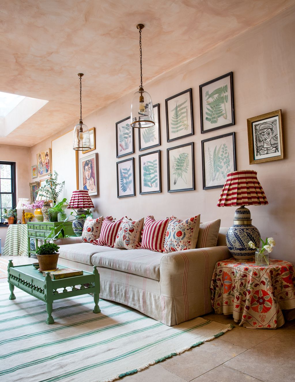 Image may contain Living Room Room Indoors Furniture Couch Table Lamp Table Lamp Cushion Interior Design and Rug