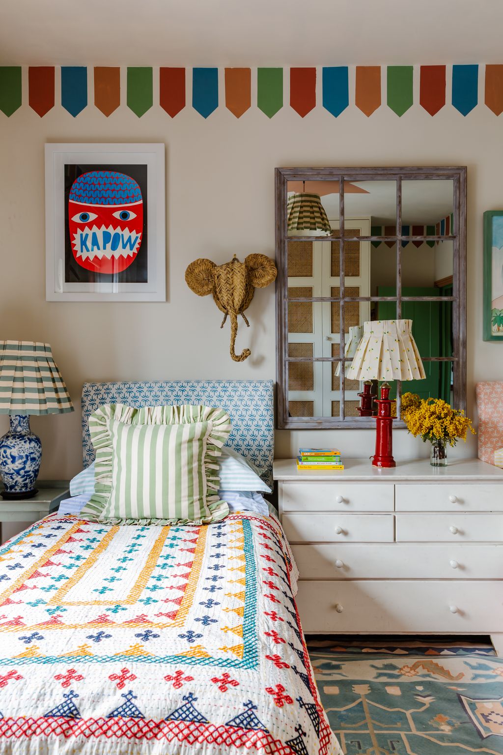 Image may contain Room Bedroom Indoors Furniture Cushion Interior Design Rug Lamp Table Lamp and Living Room