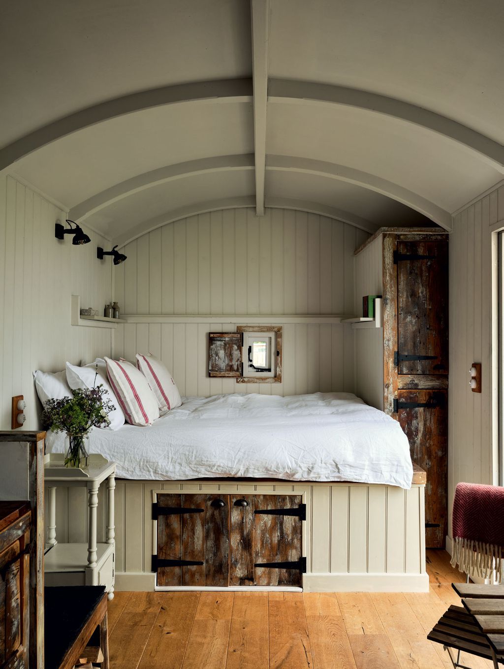 Image may contain Room Bedroom Indoors Interior Design Wood Flooring Living Room Architecture and Building