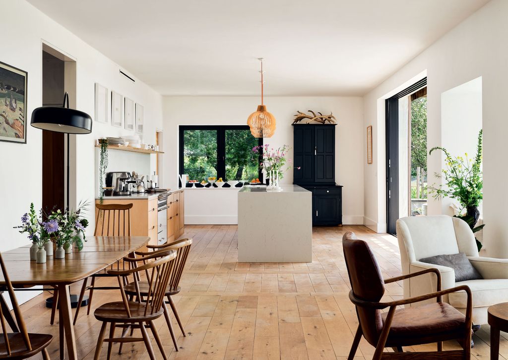 Image may contain Furniture Chair Flooring Wood Interior Design Indoors Hardwood Floor Room and Living Room