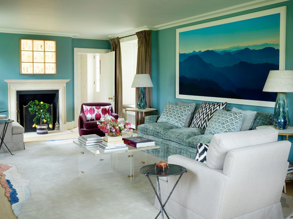 Image may contain Living Room Room Indoors Furniture Couch Interior Design Table and Rug