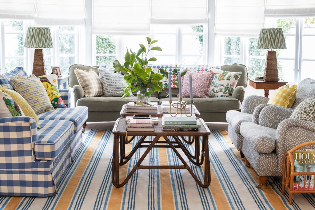 Image may contain Furniture Table Coffee Table Living Room Room Indoors Chair Tabletop Couch Home Decor and Rug