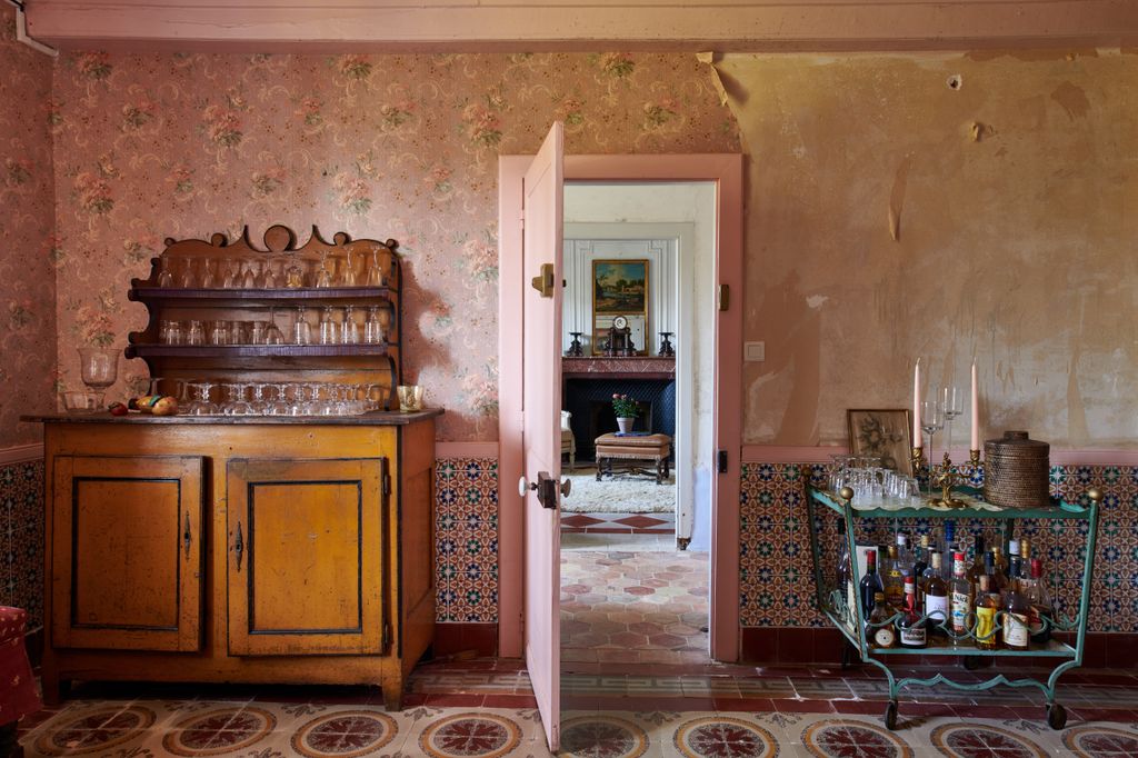 Image may contain Furniture Flooring Human Person Floor Sideboard Cupboard Closet and Wood