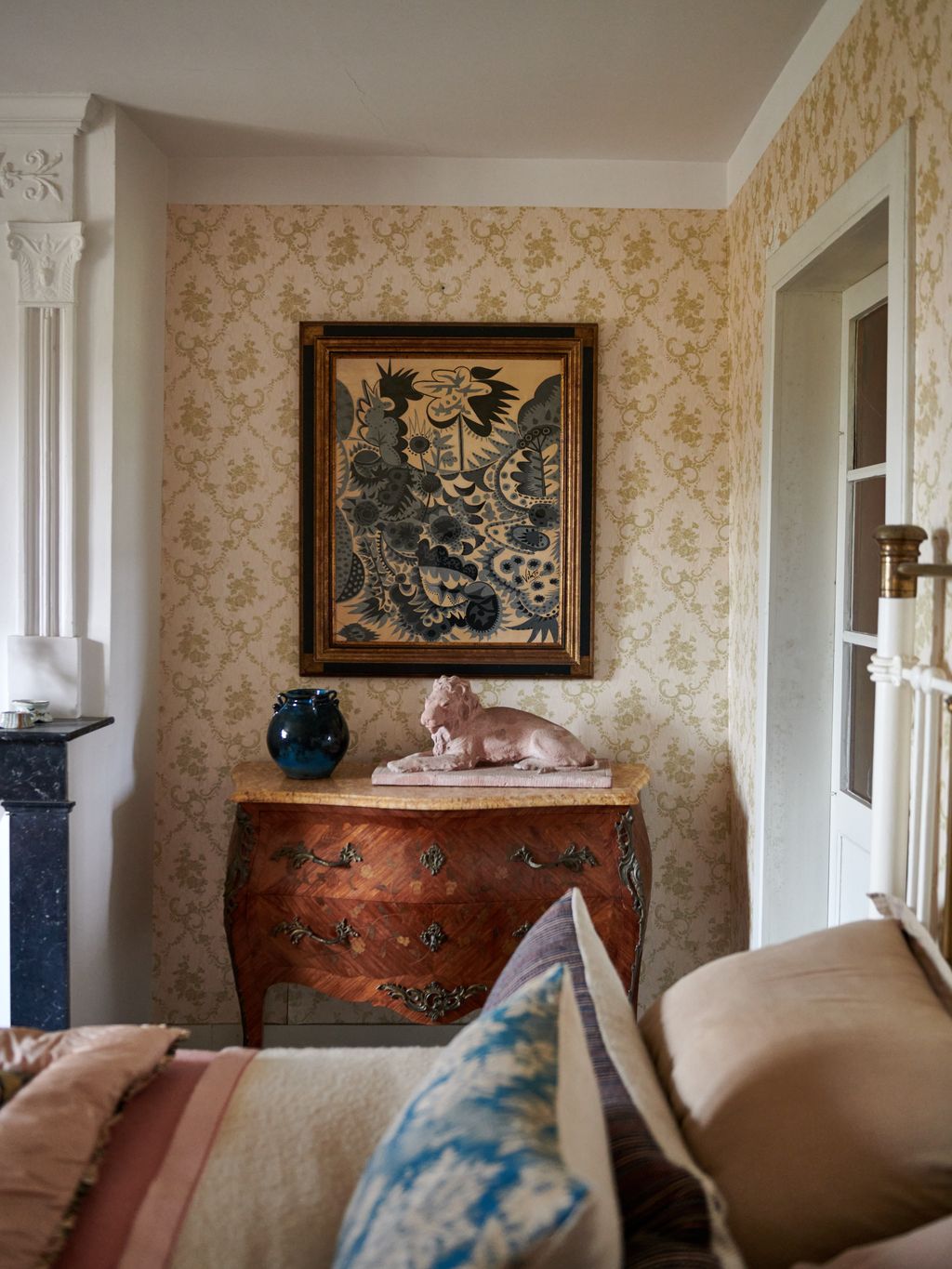 Image may contain Furniture Interior Design Indoors Living Room Room Couch Animal Mammal Pet Cat and Cabinet