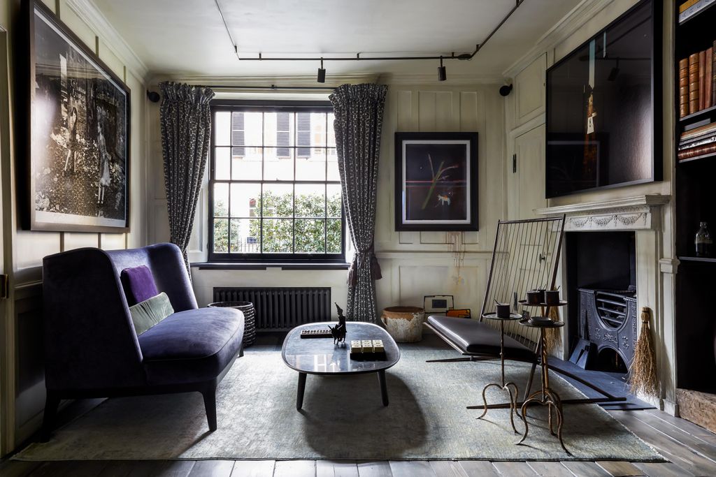 Image may contain Furniture Living Room Indoors Room Couch Table Building Housing Coffee Table and Interior Design