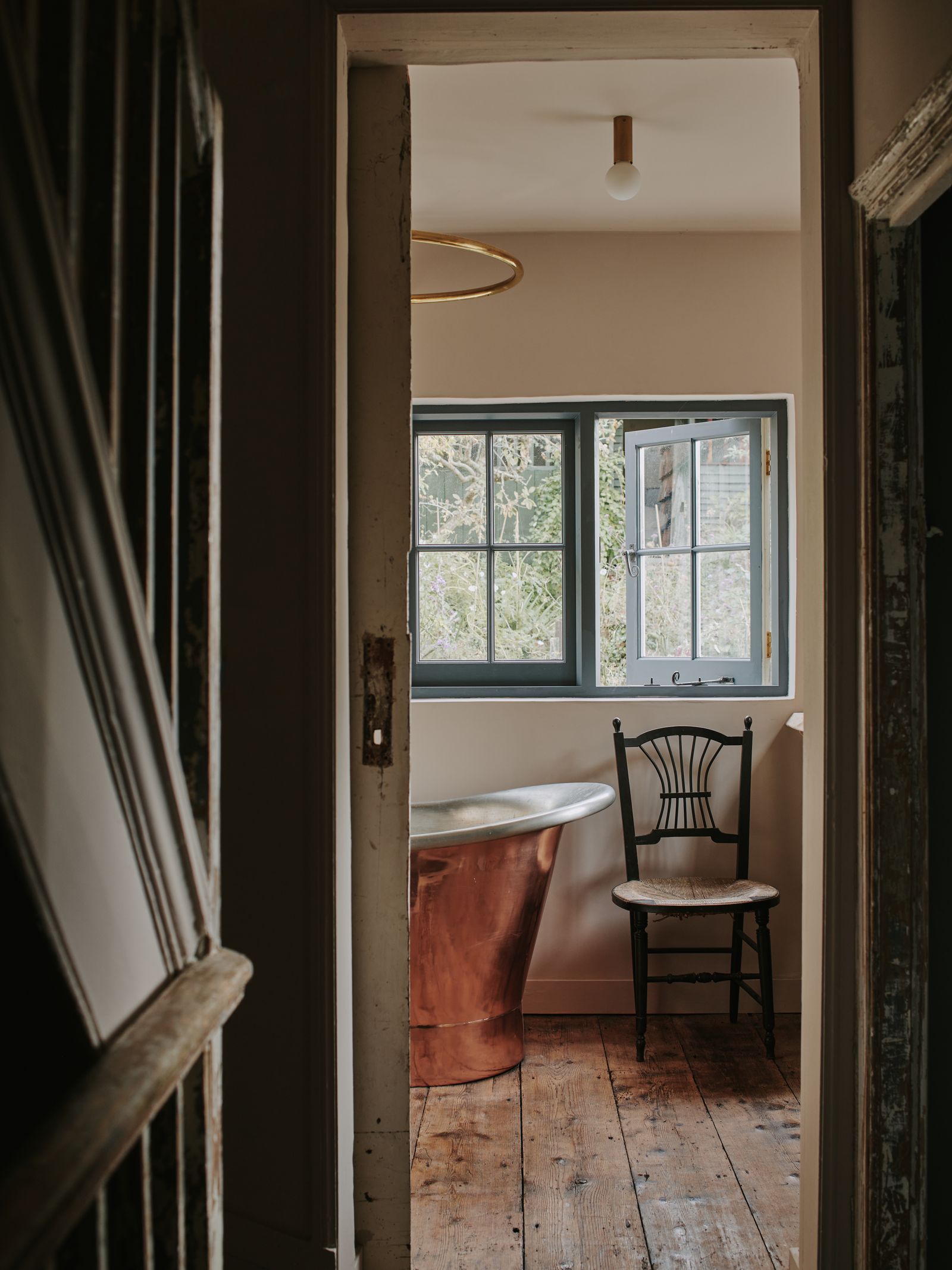 Image may contain Floor Flooring Wood Furniture Chair Home Decor Door and Hardwood