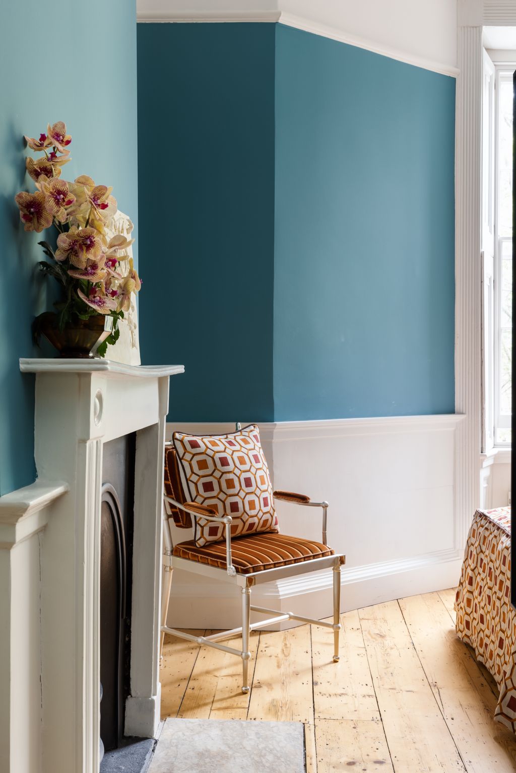 Image may contain Furniture Chair Interior Design Indoors Plant Home Decor Flower Blossom and Flower Arrangement