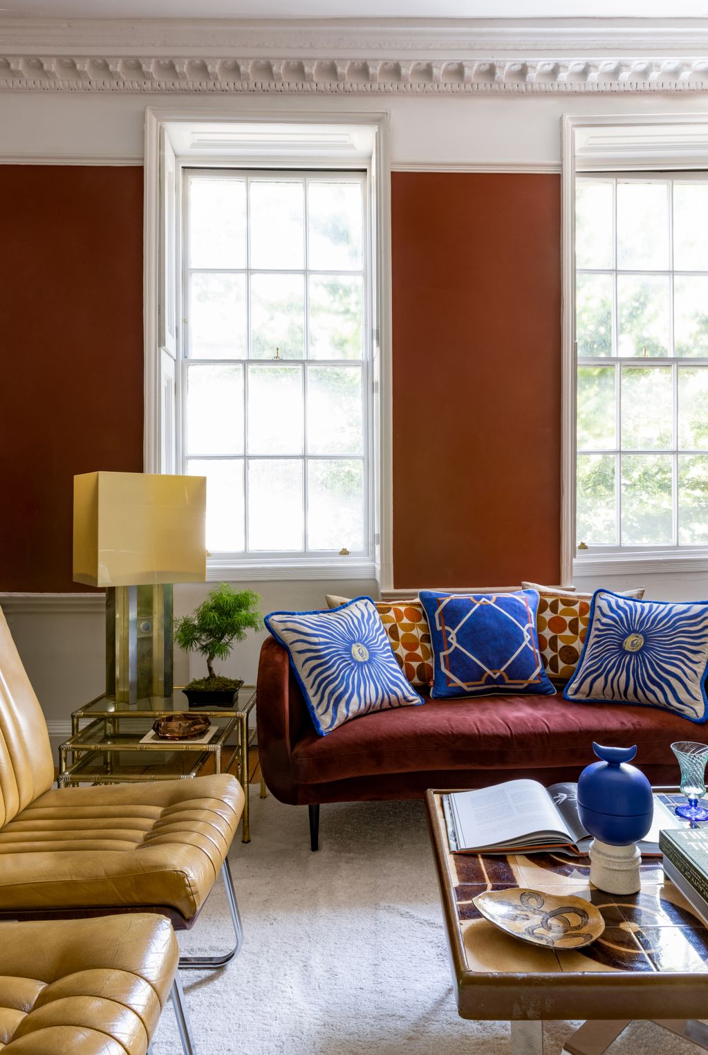 Image may contain Couch Furniture Living Room Indoors Room Lamp Table Lamp Cushion and Table