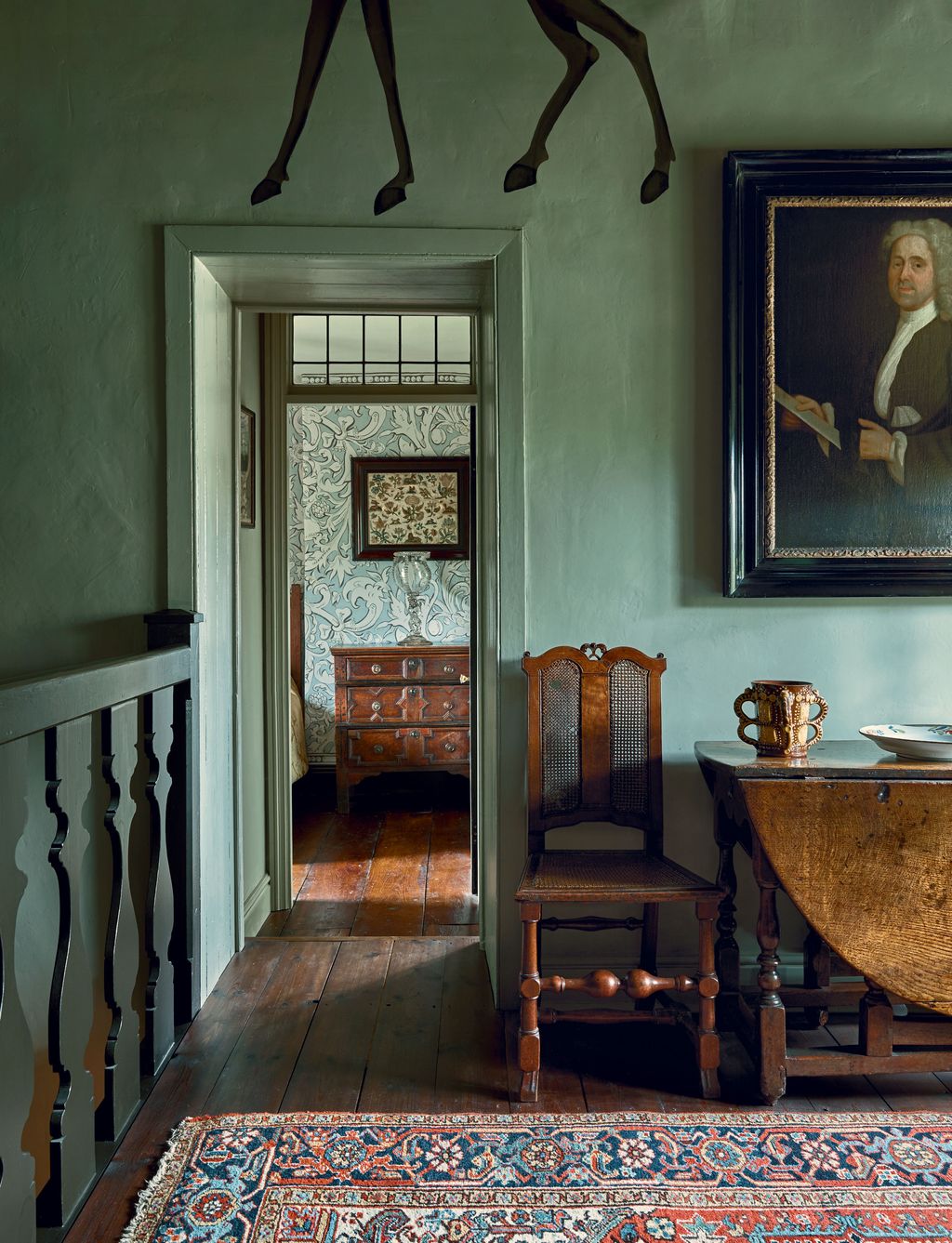 Image may contain Flooring Human Person Hardwood Wood Floor Furniture Chair Interior Design Indoors and Banister