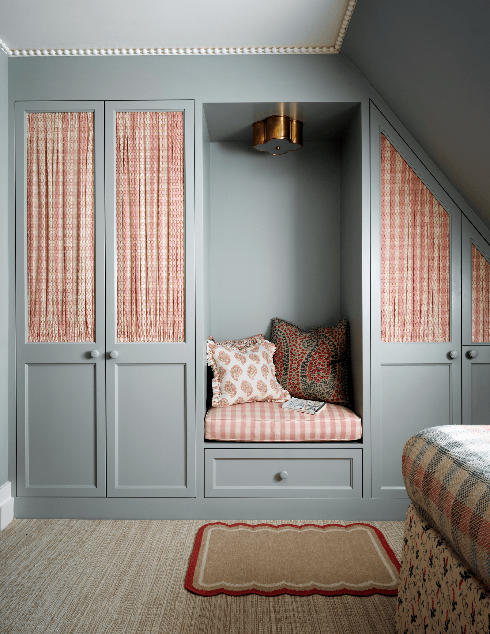 Image may contain Furniture Indoors Room Bedroom Rug Cushion and Pillow