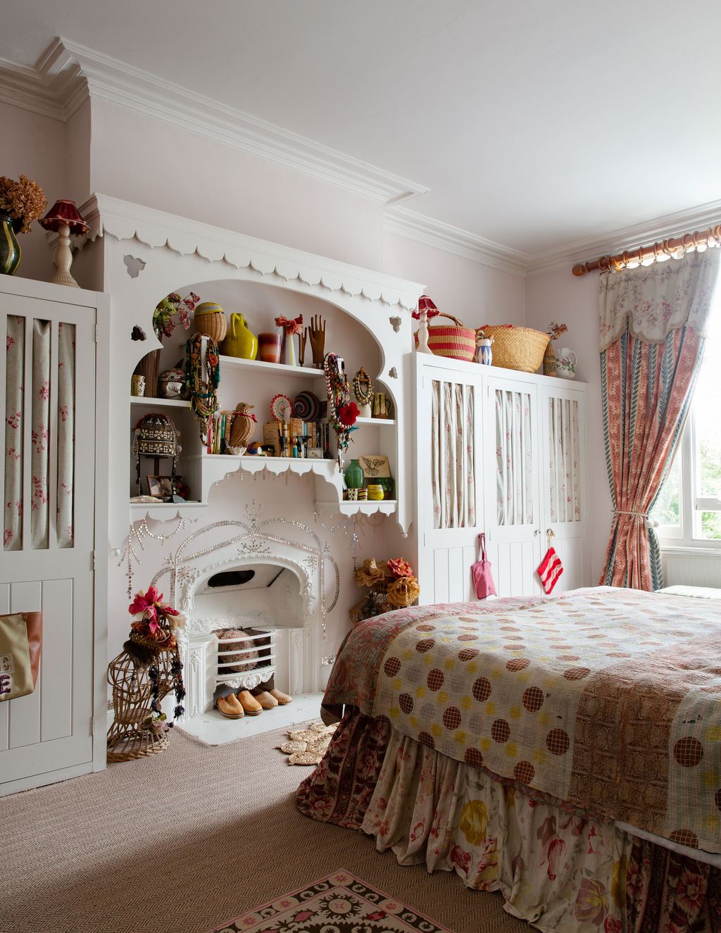 Image may contain Interior Design Indoors Furniture Shelf Home Decor Room Living Room Bedroom Bed and Plant