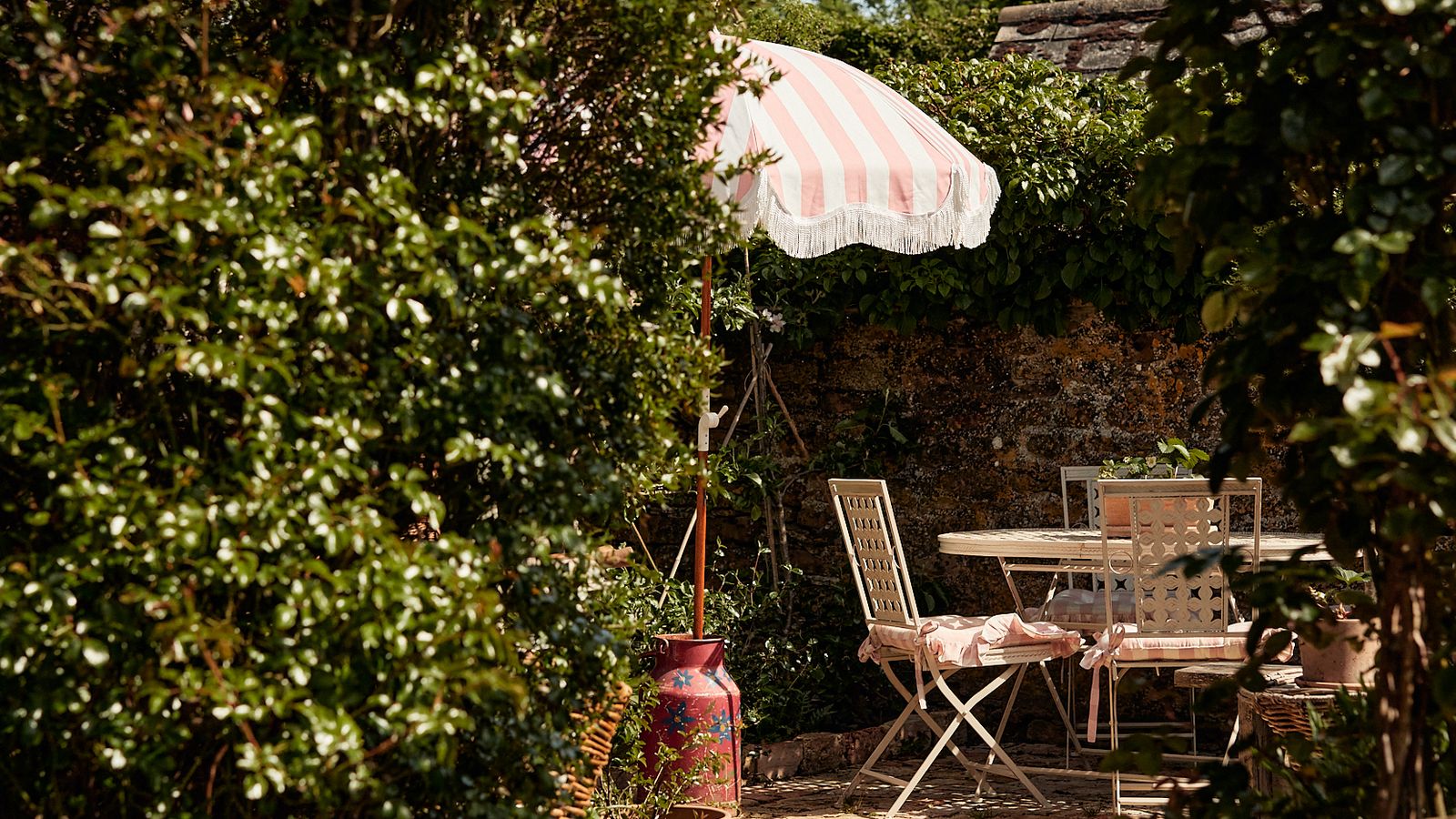 Image may contain: Furniture, Chair, Patio, Porch, Outdoors, and Pergola