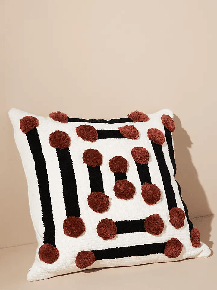 Image may contain: Cushion, Pillow, Rug, Food, and Dessert