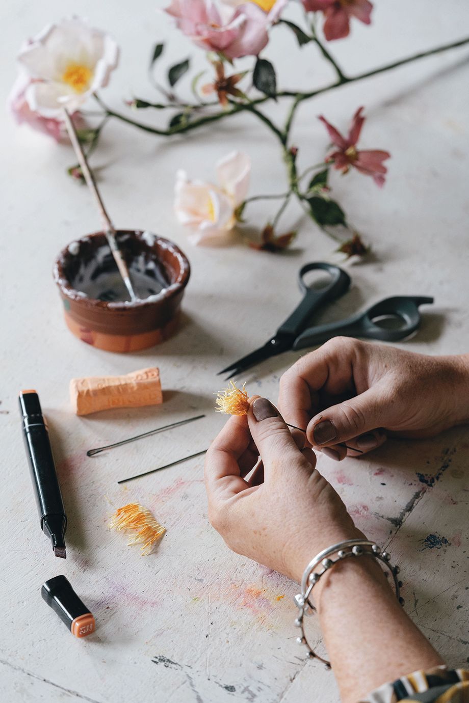 Image may contain Human Person Pen Scissors Blade Weapon Weaponry and Finger