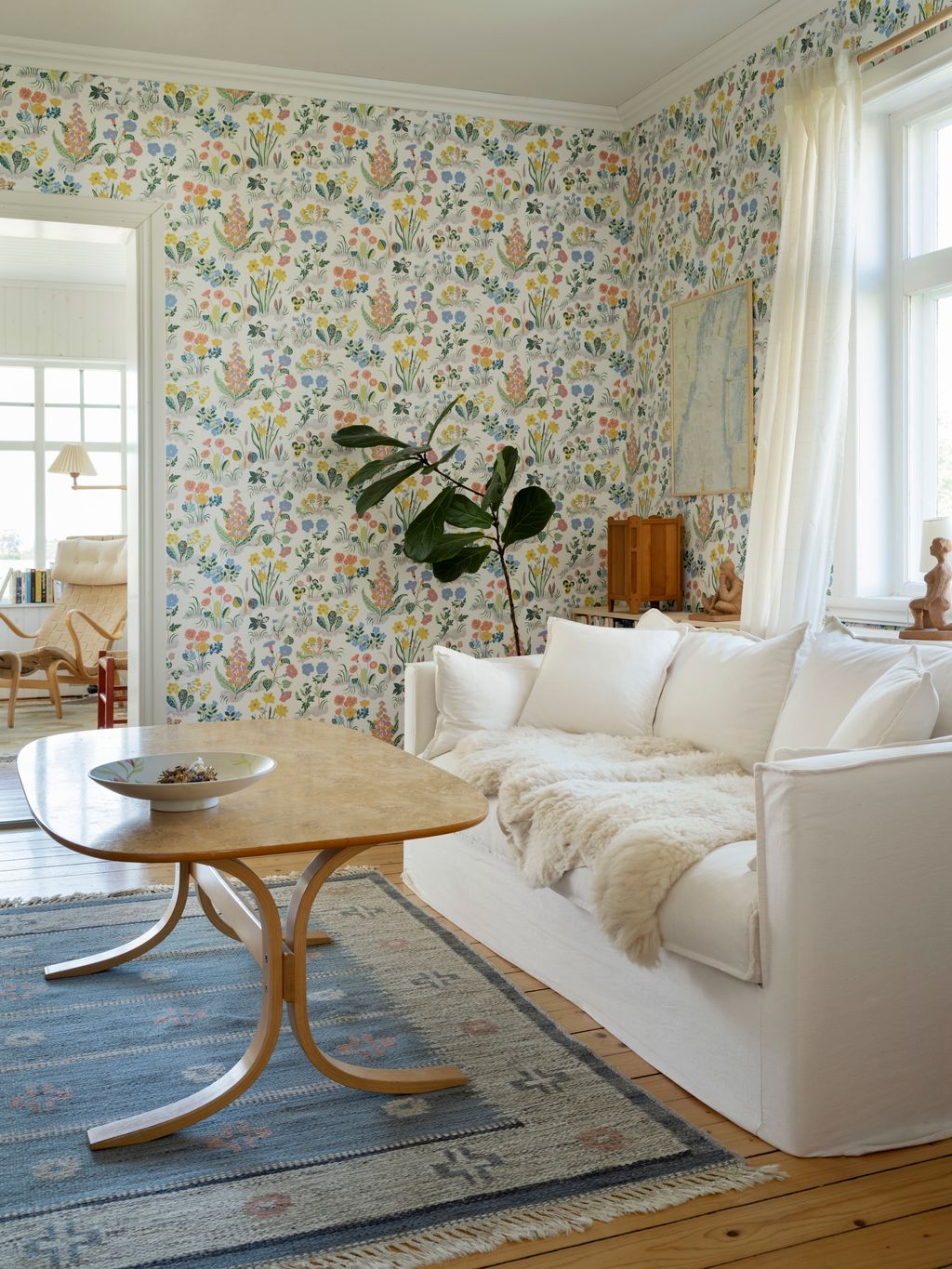 Image may contain Furniture Table Coffee Table Living Room Indoors Room Rug Couch and Interior Design